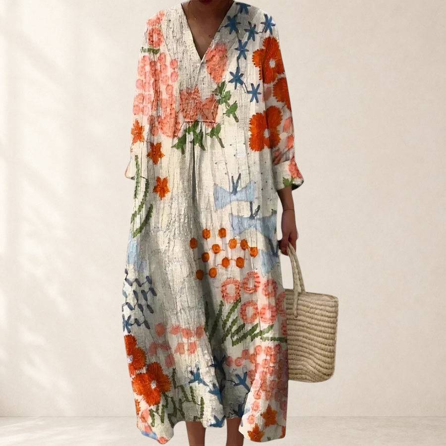Comfortable gray dress from THE WHITMORE FAMILY’s Graysynne collection, shown on a model, featuring a relaxed fit and casual style.