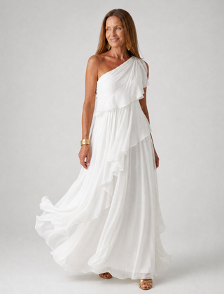 Talia cascading ruffle maxi dress by THE WHITMORE FAMILY, flowing fabric with layered ruffles, elegant and stylish for formal occasions.