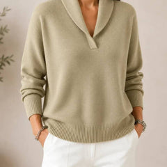 Soft V-neck women's sweater by THE WHITMORE FAMILY, featuring a cozy knit fabric and a relaxed fit in a neutral color.