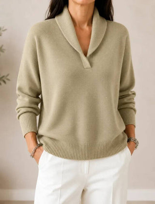 Soft V-neck women's sweater by THE WHITMORE FAMILY, featuring a cozy knit fabric and a relaxed fit in a neutral color.