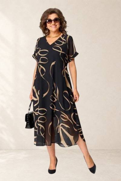 Elegant NORA dress by THE WHITMORE FAMILY, featuring a cozy and stylish design in a flattering fit and soft fabric.