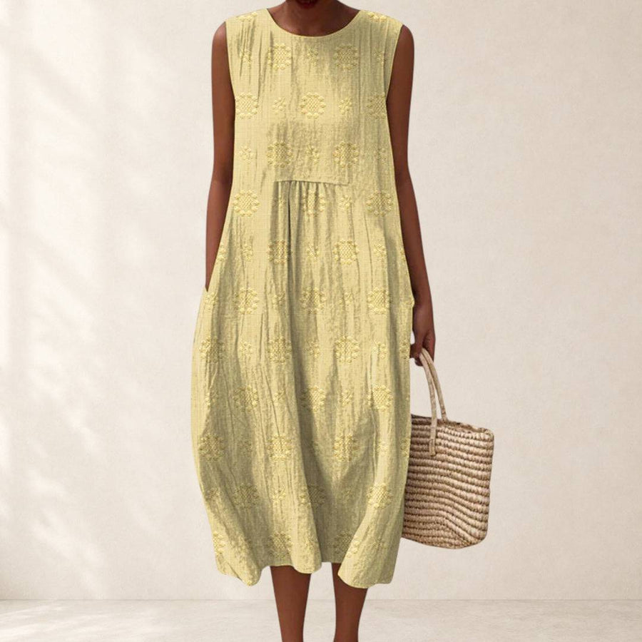 Elegant Teresa™ dress with pockets by THE WHITMORE FAMILY, shown in a stylish, flowing design with a comfortable fit.