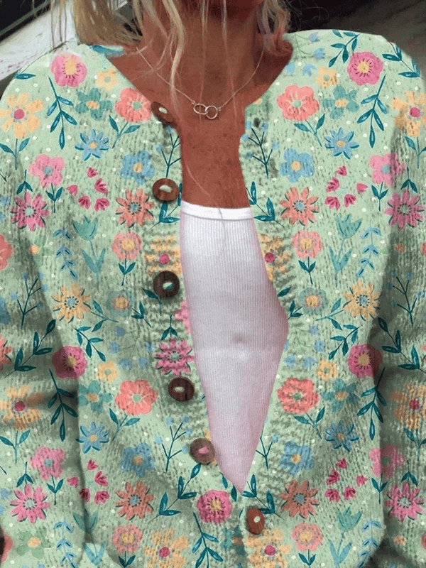 Women's vintage floral cardigan from Foxfield™ by THE WHITMORE FAMILY, featuring a colorful, patterned knit design.