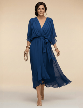 Mona V-neck dress by THE WHITMORE FAMILY, featuring a stylish V-neckline and elegant fit, shown in a full-length view.