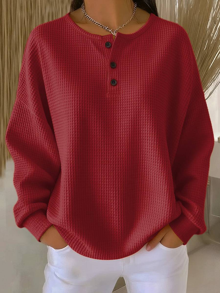 Women’s Cosy Waffle Henley Sweatshirt by THE WHITMORE FAMILY, featuring a textured waffle knit and a Henley neckline.