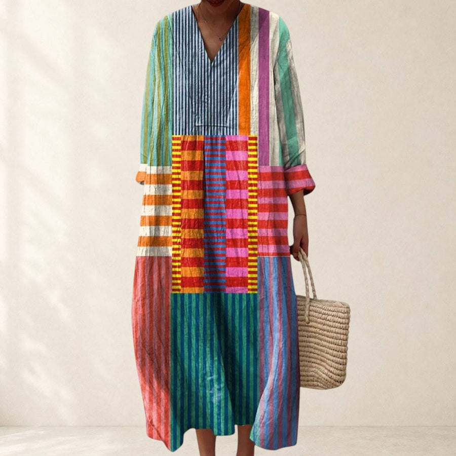 Stephanie™ Geometric Dress by THE WHITMORE FAMILY, shown in a stylish geometric pattern, with a fitted silhouette and vibrant colors.