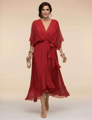 Mona V-Neck Dress by THE WHITMORE FAMILY, stylish sleeveless dress with a fitted waist and elegant V-neckline.