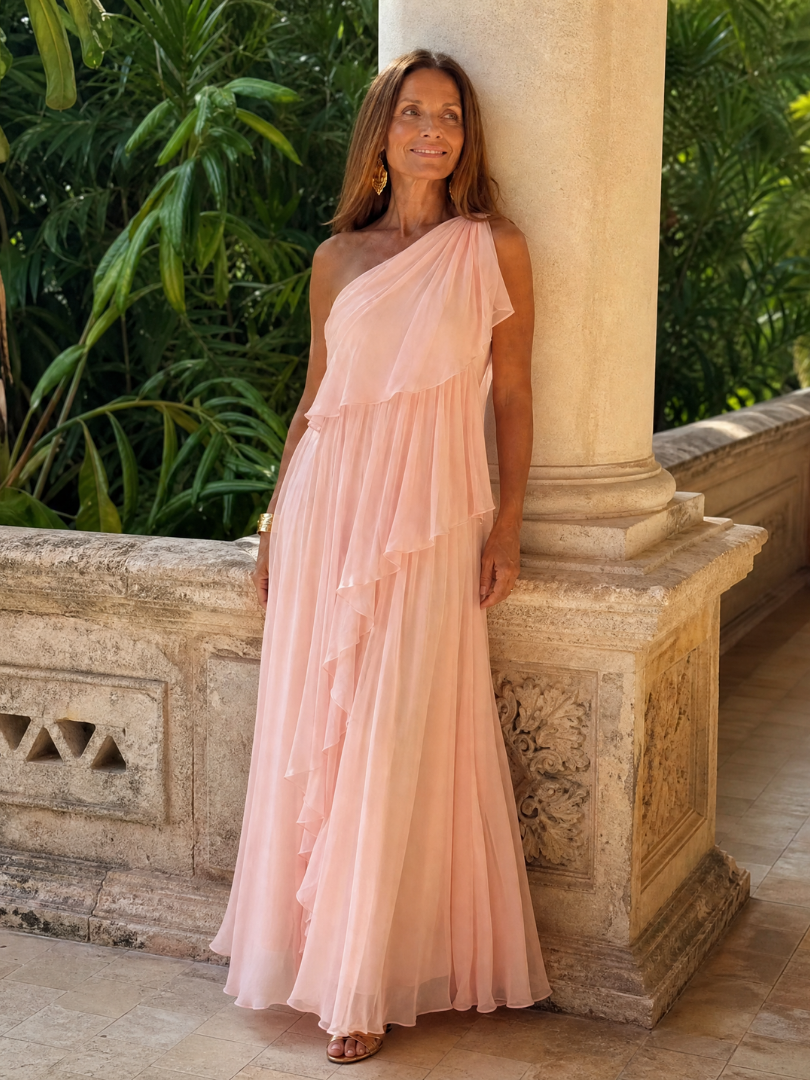Talia cascading ruffle maxi dress by THE WHITMORE FAMILY featuring flowing fabric and layered ruffles for an elegant look.
