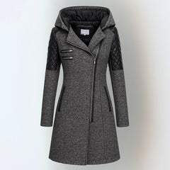Katrin™ winter jacket by THE WHITMORE FAMILY, elegant and warm with a stylish design, shown in a cozy outdoor setting.