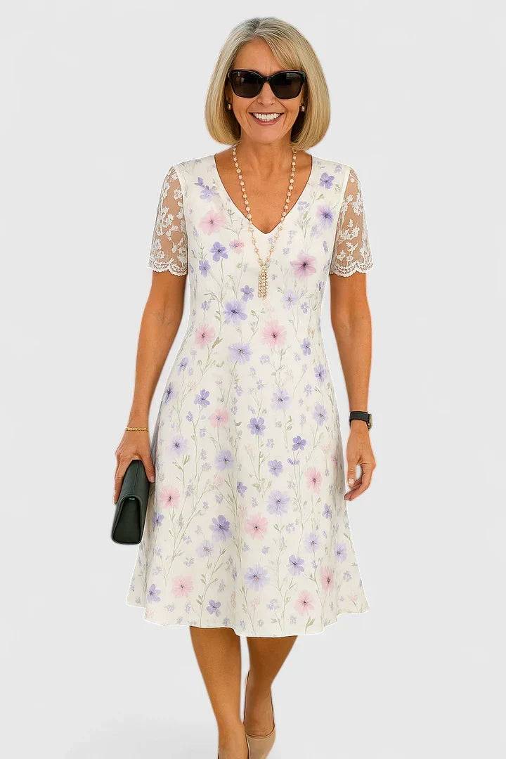 Elegant midi dress by THE WHITMORE FAMILY featuring a fitted silhouette, soft fabric, and stylish neckline.