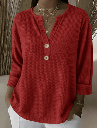 Women’s Henley button sweater by THE WHITMORE FAMILY, featuring a cozy knit fabric and classic henley neckline.