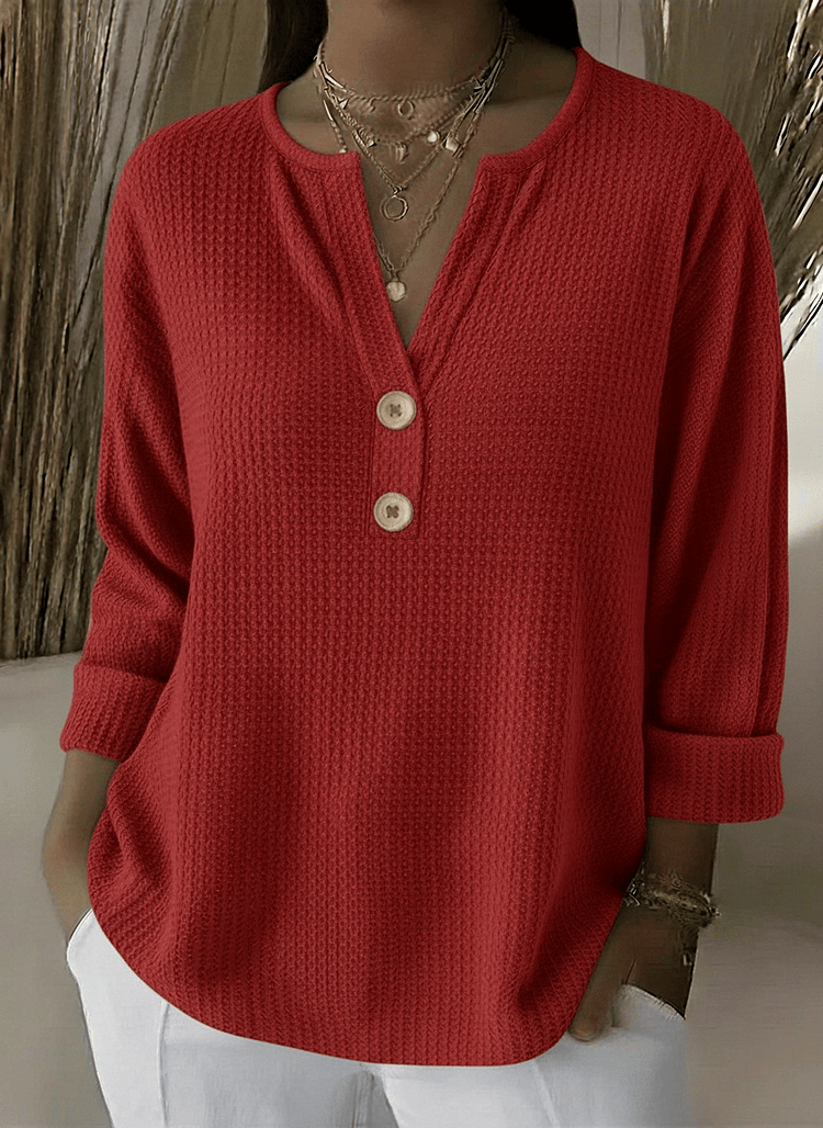 Women’s Henley button sweater by THE WHITMORE FAMILY, featuring a cozy knit fabric and classic henley neckline.