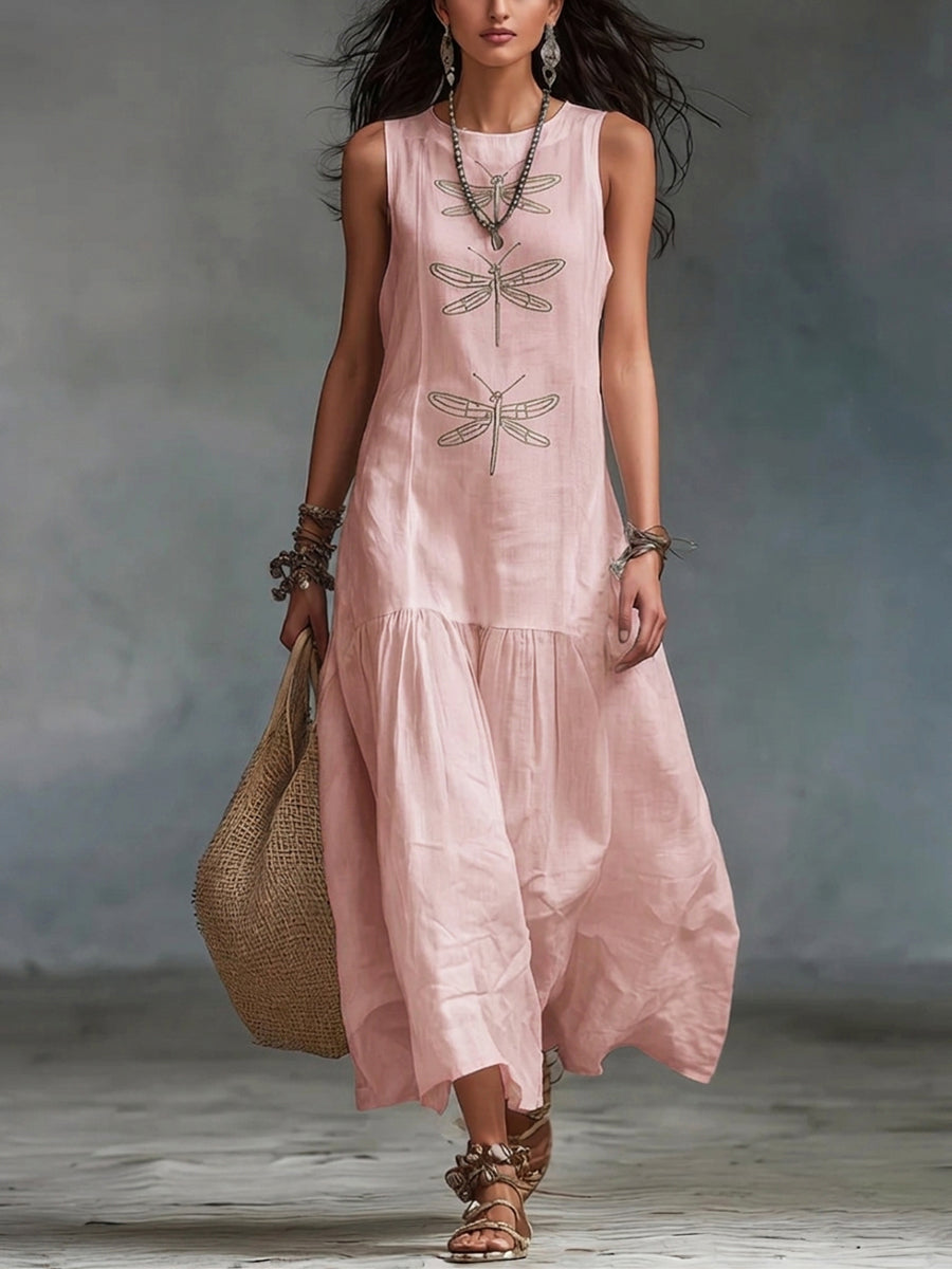 Geneva sleeveless maxi dress by THE WHITMORE FAMILY, flowing fabric, ankle length, and stylish neckline in a vibrant color.