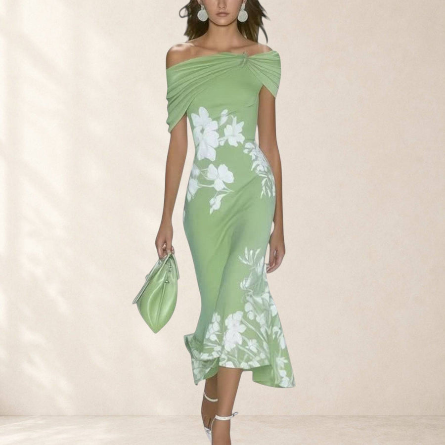 Elegant Isabrunel midi dress by THE WHITMORE FAMILY displayed on a model, featuring a flowing fabric and stylish design.