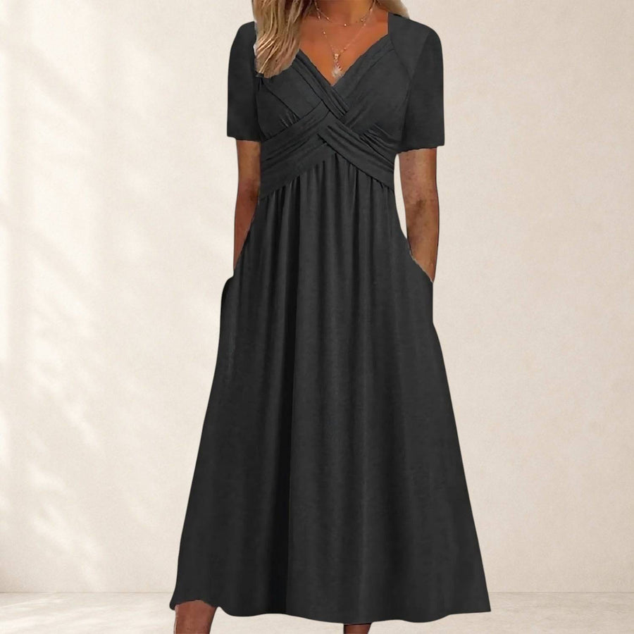 Viola™ midi dress with tummy control from THE WHITMORE FAMILY, featuring a fitted silhouette and stylish design, shown on a model.