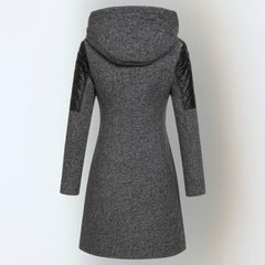 Katrin™ winter jacket by THE WHITMORE FAMILY, stylish and warm, shown in a cozy outdoor setting with a front view.
