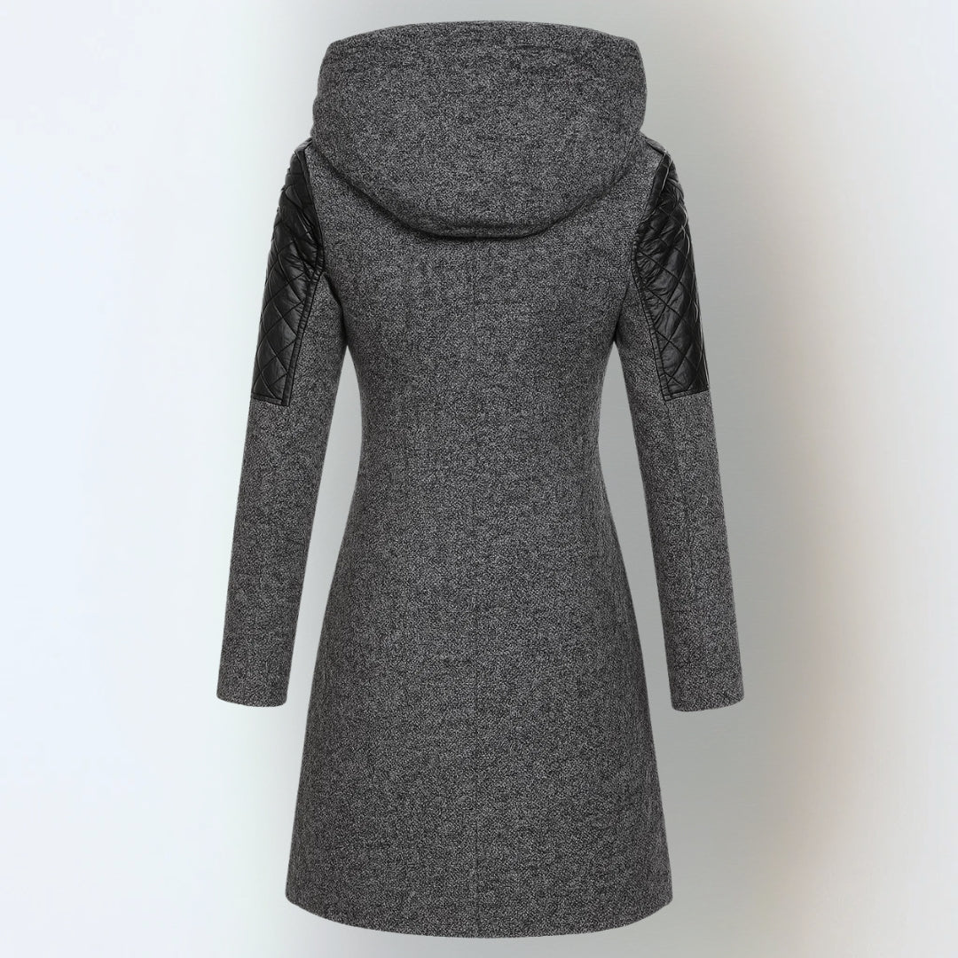 Katrin™ winter jacket by THE WHITMORE FAMILY, stylish and warm, shown in a cozy outdoor setting with a front view.