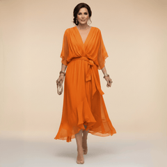 Mona V-neck dress by THE WHITMORE FAMILY featuring a stylish, flowy design in a flattering silhouette.