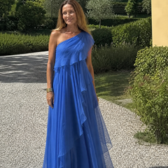 Talia cascading ruffle maxi dress by THE WHITMORE FAMILY, flowing fabric with layered ruffles, elegant full-length design.
