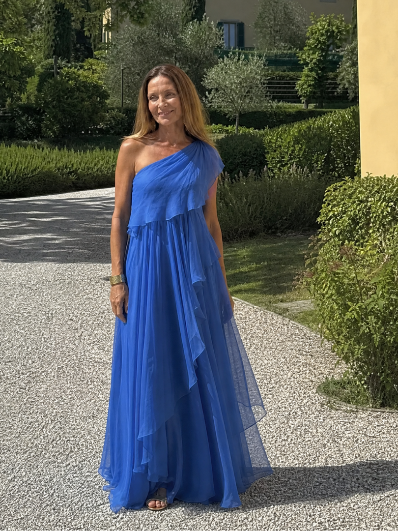 Talia cascading ruffle maxi dress by THE WHITMORE FAMILY, flowing fabric with layered ruffles, elegant full-length design.