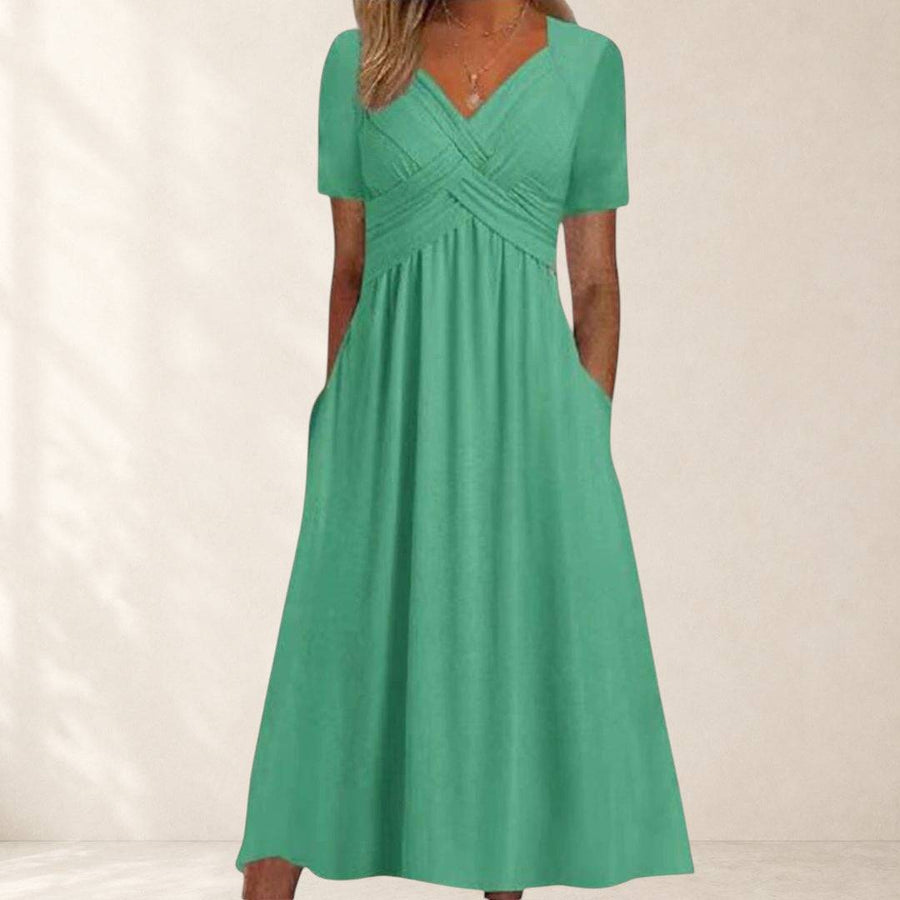 Amanda flattering dress by THE WHITMORE FAMILY, shown in a stylish design with a fitted silhouette and elegant details.
