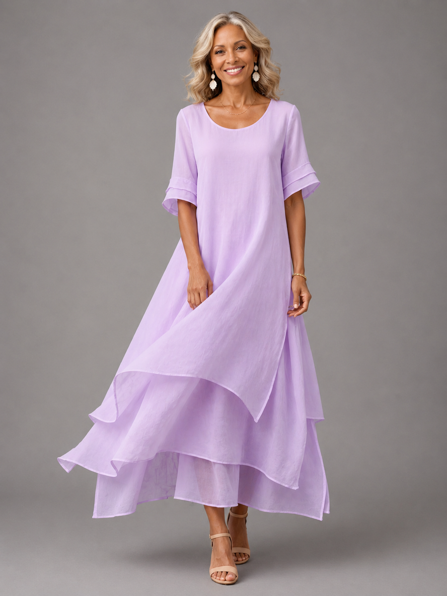 Flowing Grace Maxi Dress by THE WHITMORE FAMILY featuring a flowing silhouette, soft fabric, and elegant design.