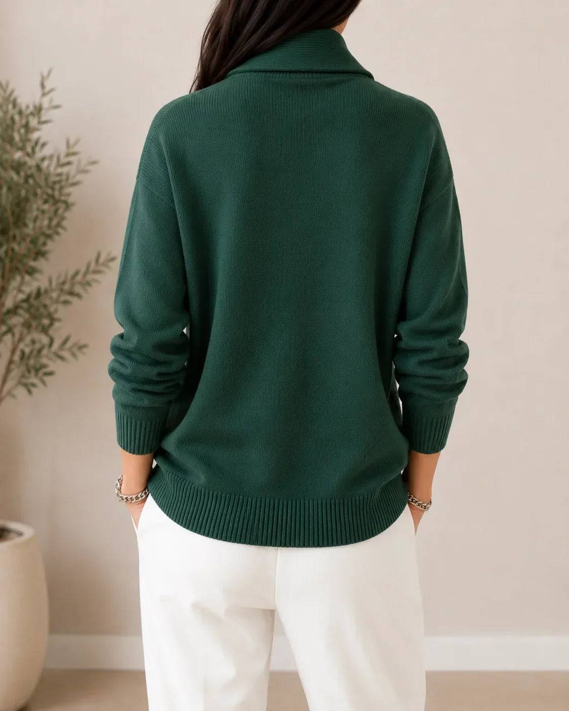 Soft V-neck women's sweater by THE WHITMORE FAMILY, featuring a cozy knit fabric and a relaxed fit in a neutral color.