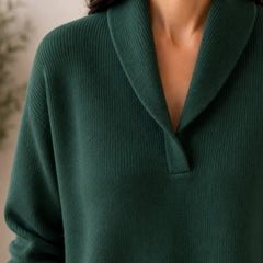 Soft V-neck women's jumper sweater by THE WHITMORE FAMILY, featuring a cozy fit and smooth knit fabric in a neutral color.