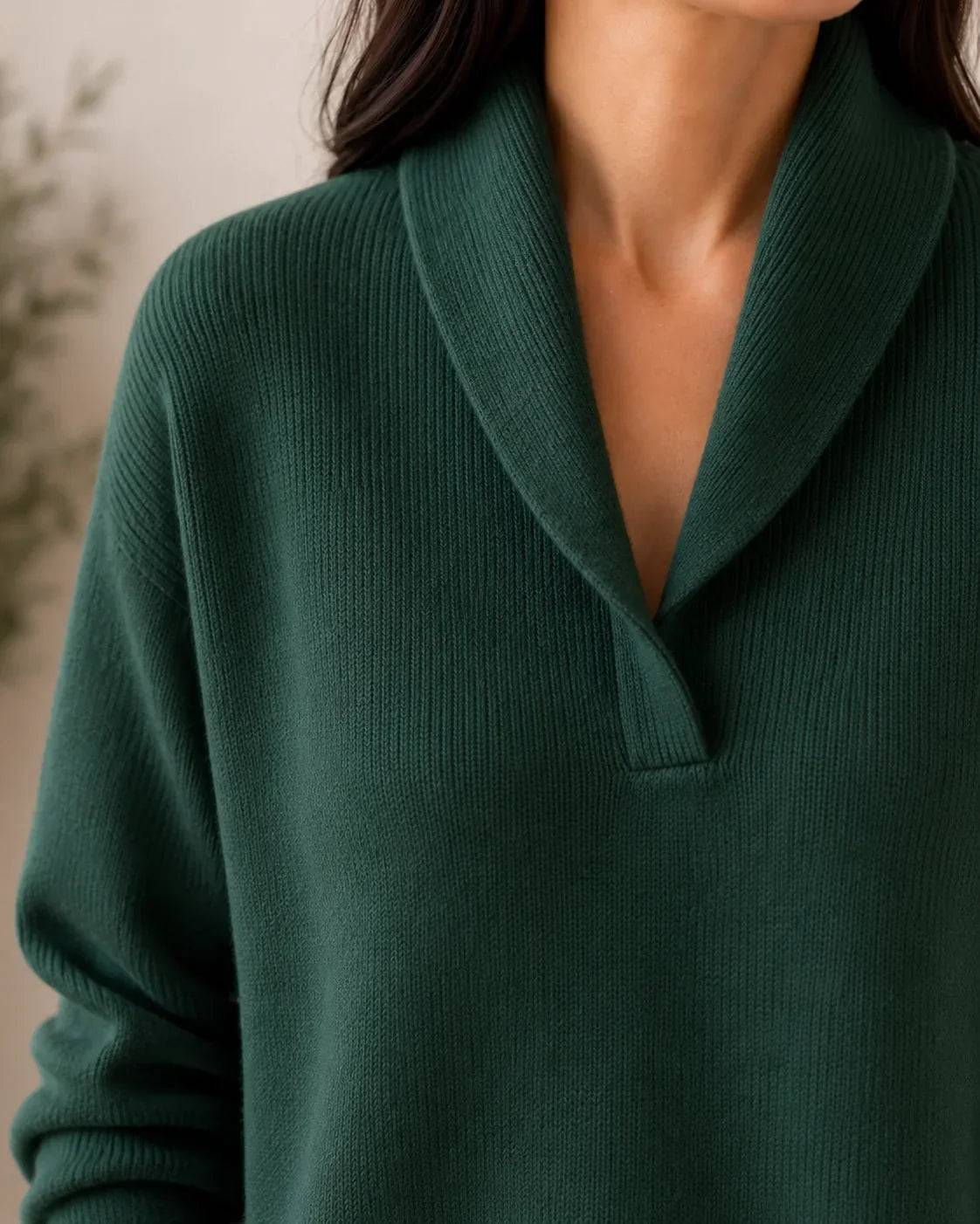 Soft V-neck women's jumper sweater by THE WHITMORE FAMILY, featuring a cozy fit and smooth knit fabric in a neutral color.