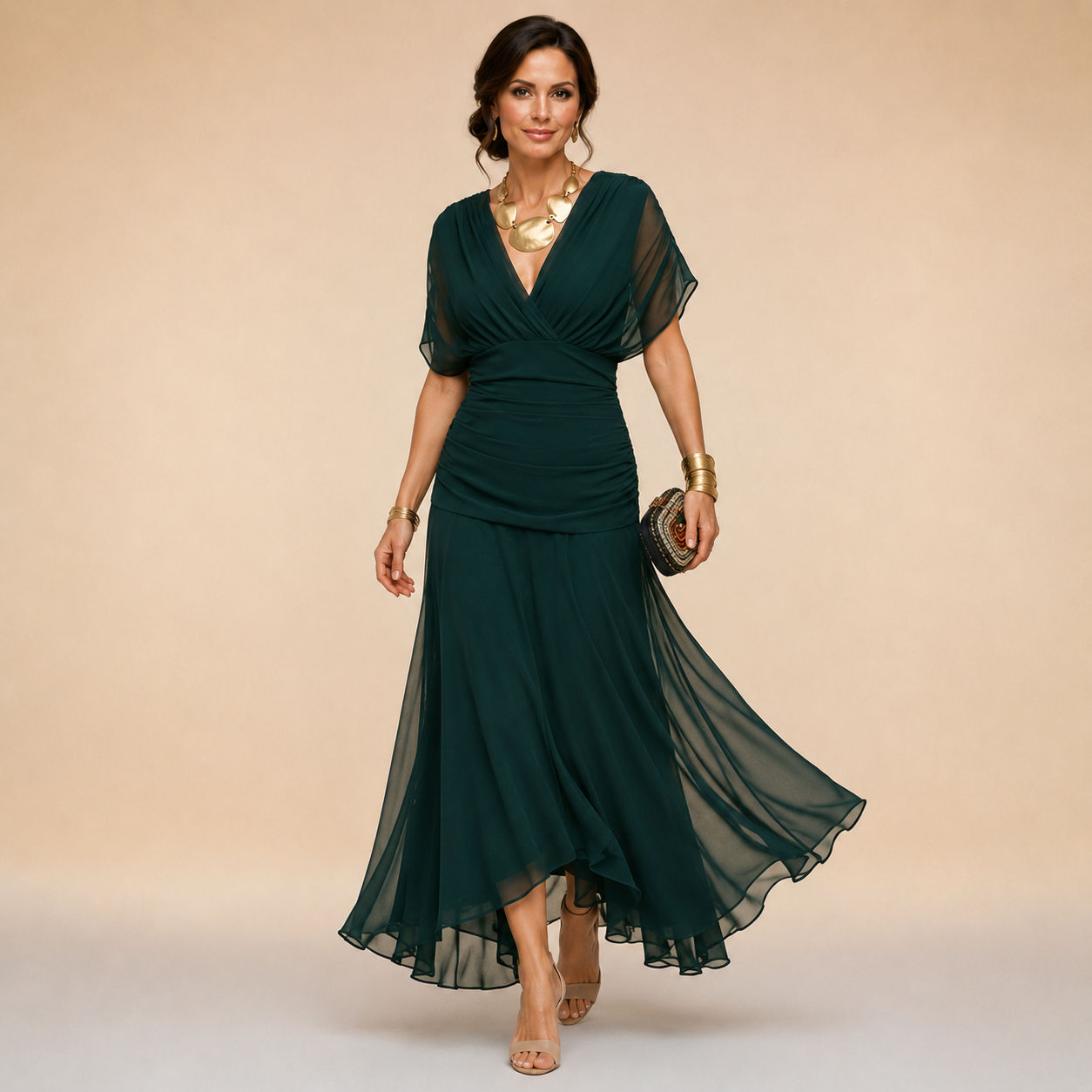 Elegant Emma maxi party dress by THE WHITMORE FAMILY, shown in flowing fabric with a stylish neckline and floor-length design.