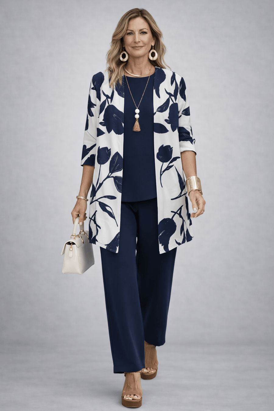 Elegant three-piece trouser set by The Whitmore Family featuring tailored trousers and matching top in a sophisticated design.