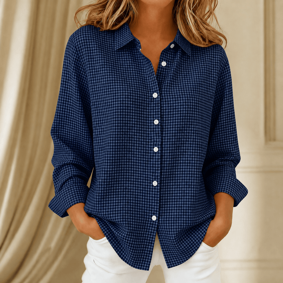 Elowen™ checkered button-up shirt from THE WHITMORE FAMILY, featuring a classic black and white checkered pattern and collar.