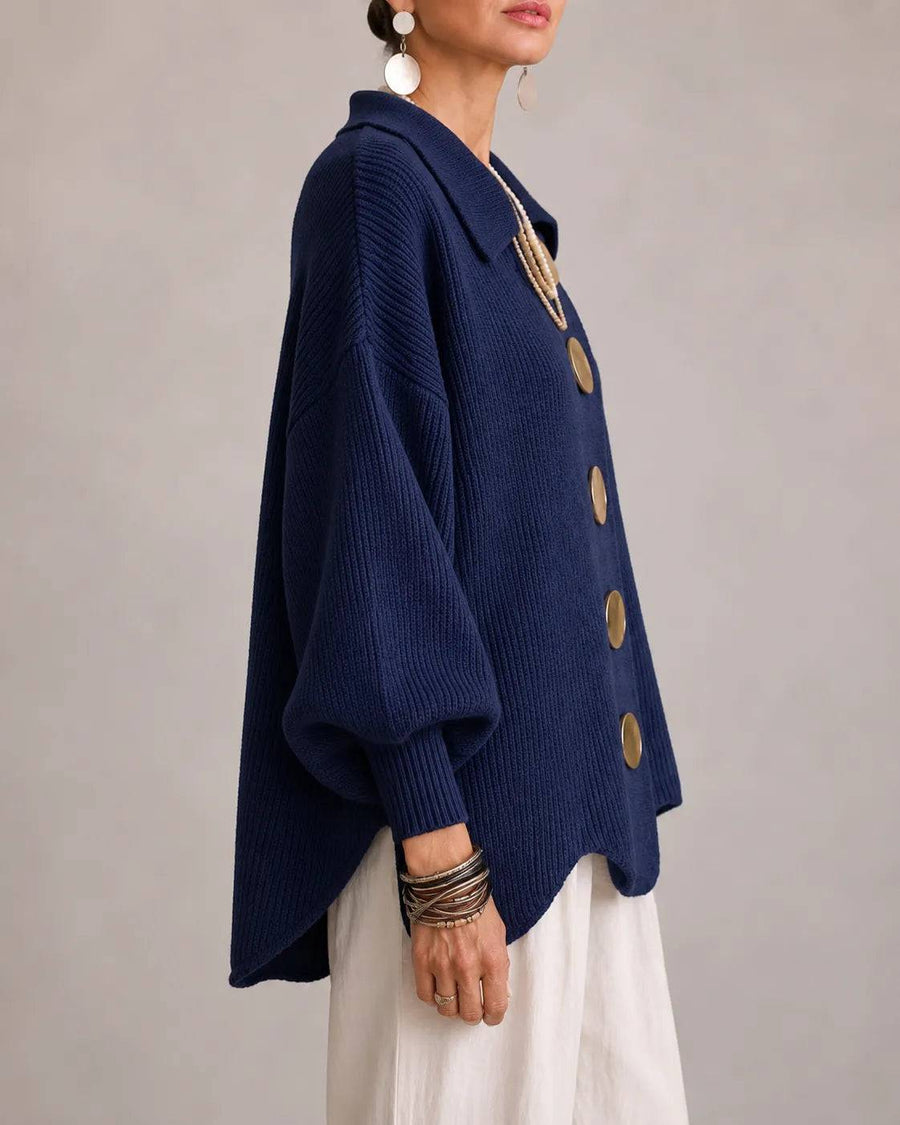 Elara oversized button knit cardigan by THE WHITMORE FAMILY, featuring a cozy, chunky knit with large buttons in neutral tones.
