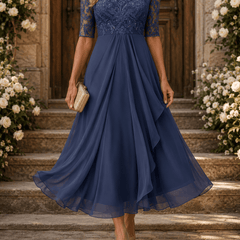 Rosa lace midi dress by THE WHITMORE FAMILY with intricate lace details and a fitted silhouette, displayed on a neutral background.