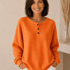 Light beige Cosy Waffle Henley Sweatshirt for women by THE WHITMORE FAMILY, featuring a textured waffle knit and button neckline.