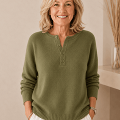 Women's Henley button-up knit sweater by THE WHITMORE FAMILY, featuring a cozy, stylish design with a buttoned neckline and ribbed texture.