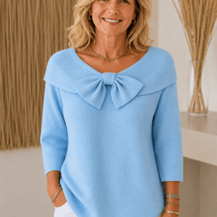 Women's sweater by THE WHITMORE FAMILY featuring a bow detail and round neckline, made of soft knit fabric.