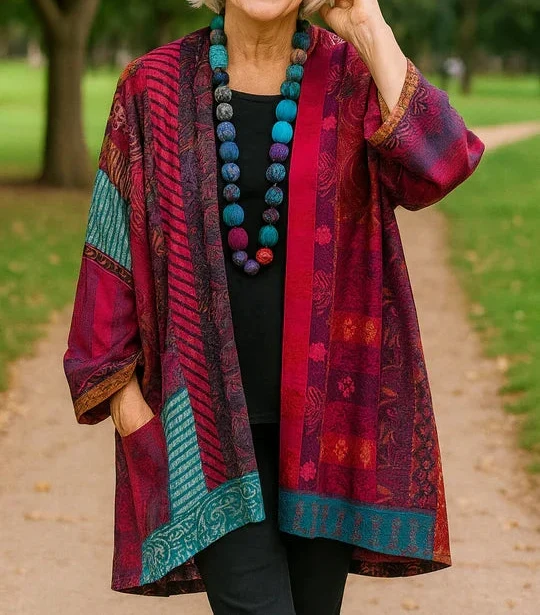 Elegant Astrid drape cardigan by THE WHITMORE FAMILY, featuring a soft, flowing fabric and a stylish, relaxed fit.