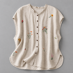Jasmine cotton linen blouse by THE WHITMORE FAMILY, featuring a relaxed fit with delicate fabric and stylish design.
