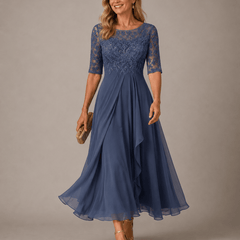 Lace midi dress in soft pink from THE WHITMORE FAMILY, featuring delicate lace fabric and a fitted silhouette.