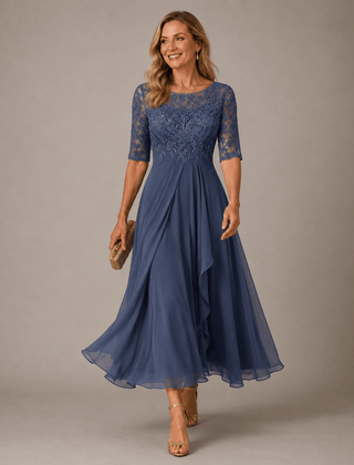 Lace midi dress in soft pink from THE WHITMORE FAMILY, featuring delicate lace fabric and a fitted silhouette.