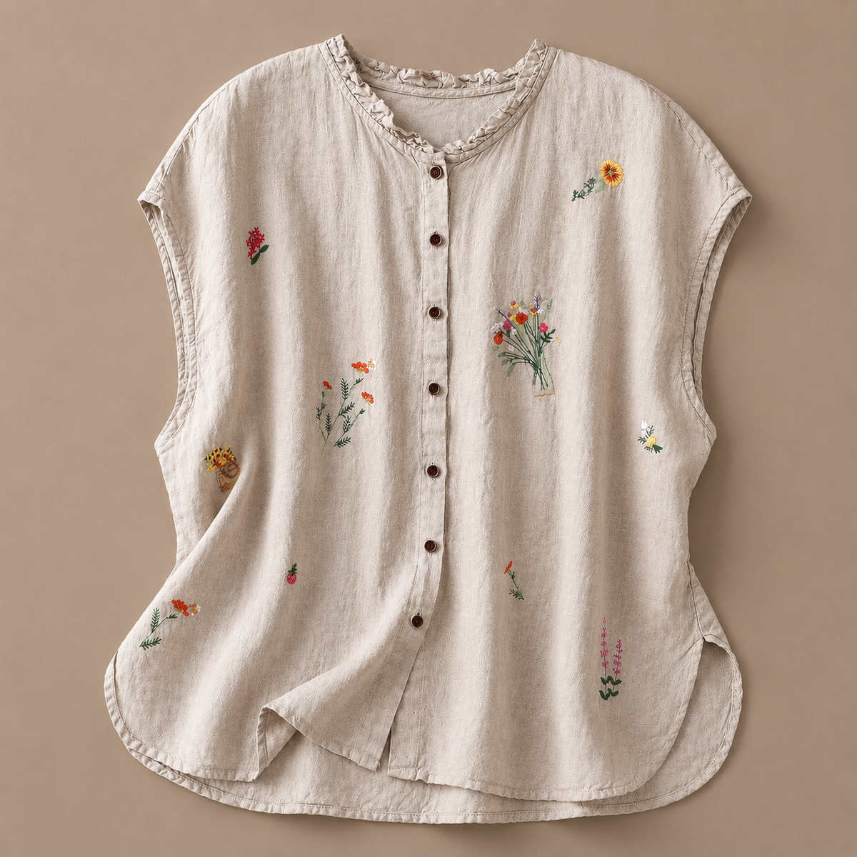 Jasmine cotton linen blouse by THE WHITMORE FAMILY featuring a relaxed fit, lightweight fabric, and delicate floral details.