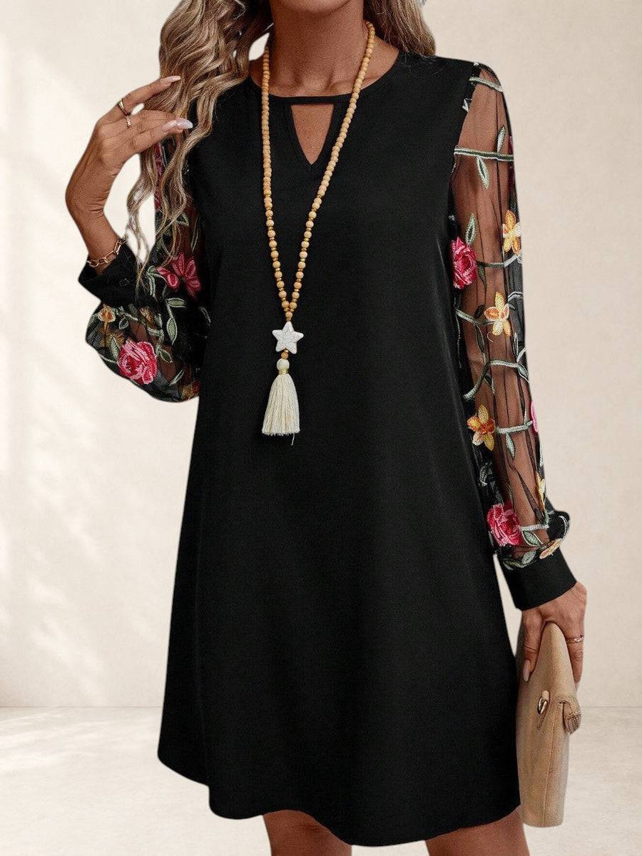 Elegant Jorli™ dress from THE WHITMORE FAMILY featuring intricate design and stylish silhouette, perfect for formal occasions.