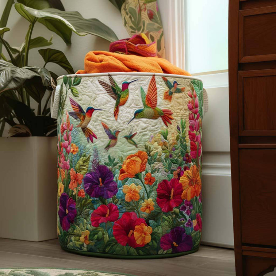 Quilted Flutter and Bloom laundry basket by THE WHITMORE FAMILY with soft fabric and sturdy handles for easy laundry transport.