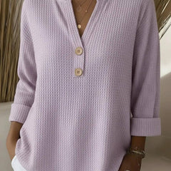 Lila-colored women's Henley button top sweater by THE WHITMORE FAMILY with a relaxed fit and button-front design.