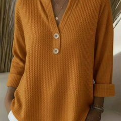 Orange women's Henley button top sweater by THE WHITMORE FAMILY, featuring a cozy knit design and buttoned front.