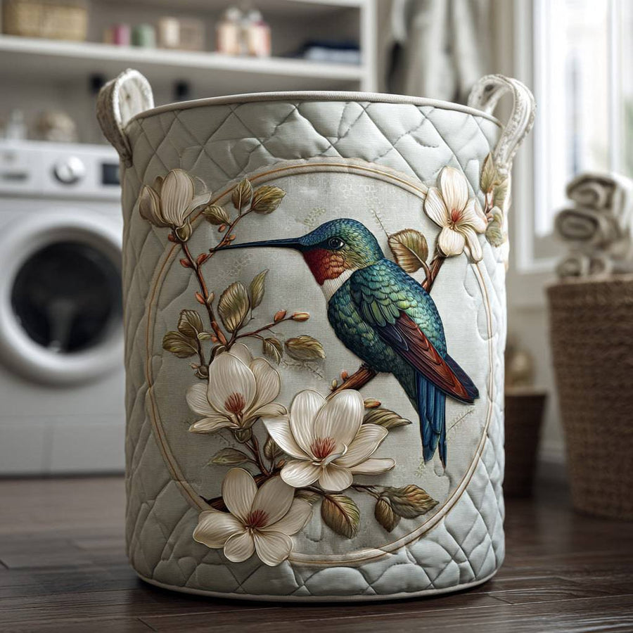 Hummingbird Lace quilted laundry basket by THE WHITMORE FAMILY with floral lace details and sturdy fabric construction.