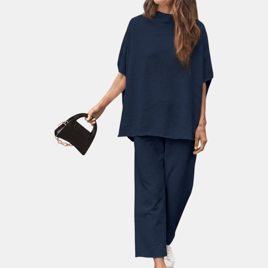 Navy women's mock neck lounge set with wide-leg cropped pants by THE WHITMORE FAMILY, shown flat on a white background.