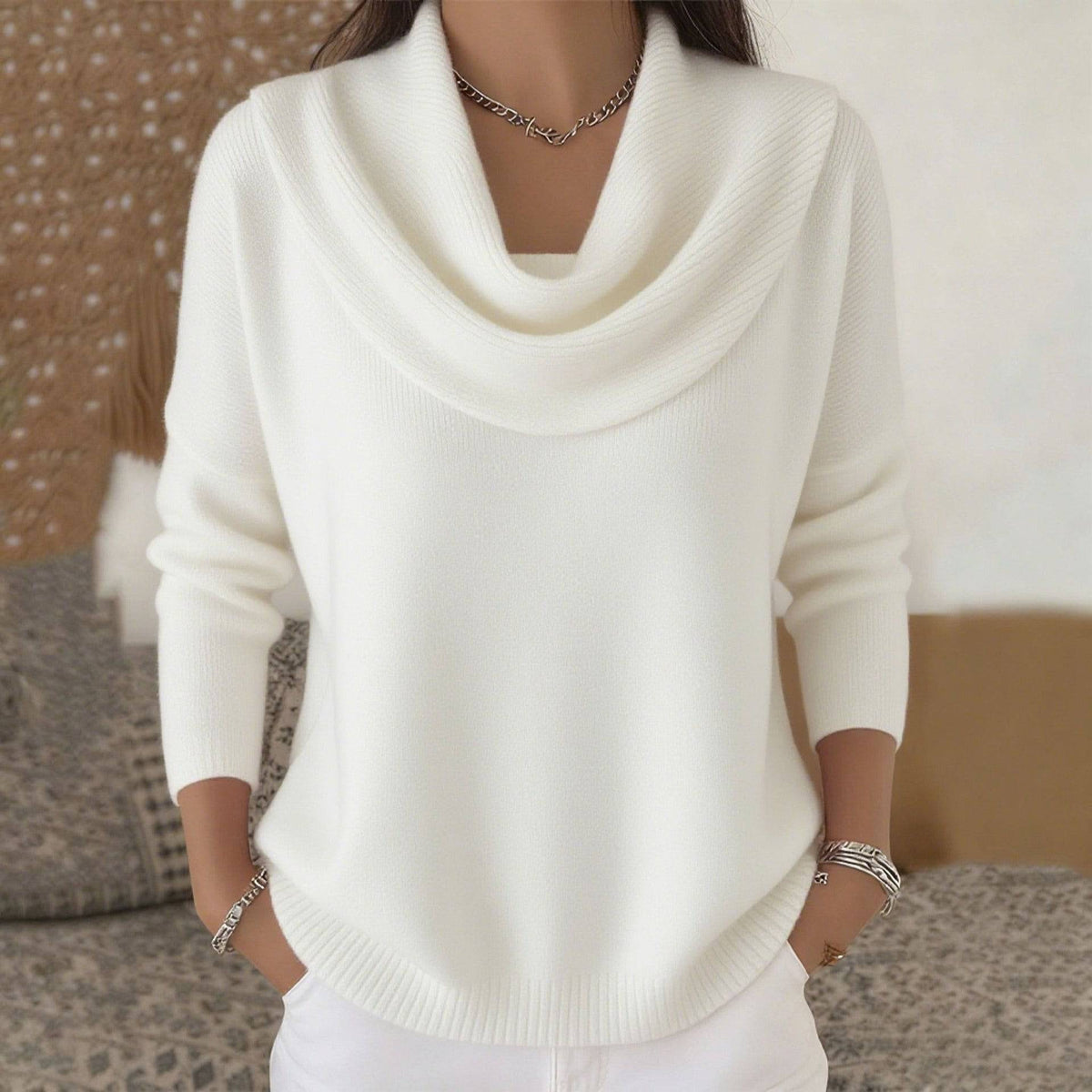 Women’s cowl neck sweater by THE WHITMORE FAMILY, cozy knit jumper with a relaxed fit and stylish drape, shown in a neutral color.