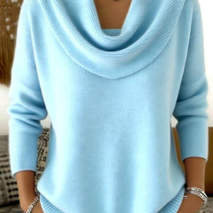 Women’s cowl neck jumper sweater by THE WHITMORE FAMILY, showcasing a cozy knit with a relaxed fit in neutral color.